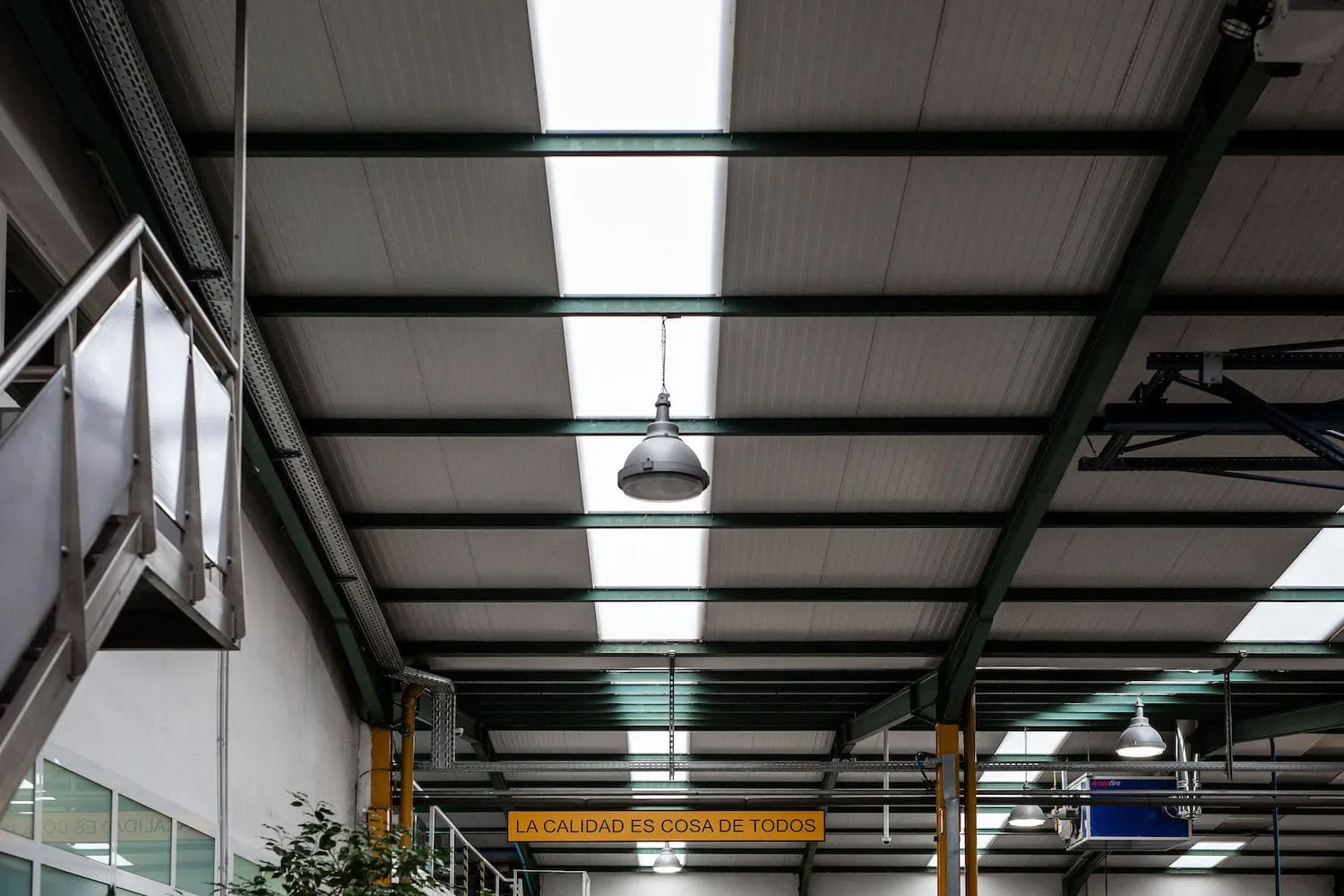 Bright production hall with skylights and an open floor between the working bays
