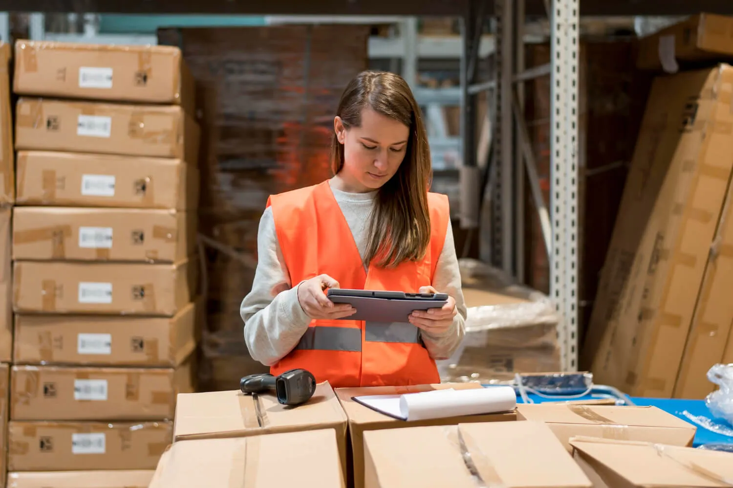 Stock levels and put-away locations being reviewed on screen in a warehouse office