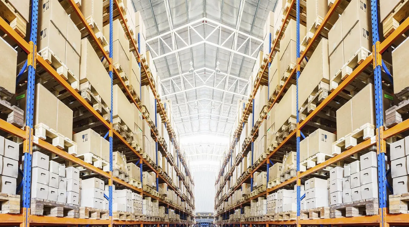 Wide-aisle pallet racking loaded with palletised stock in a distribution centre