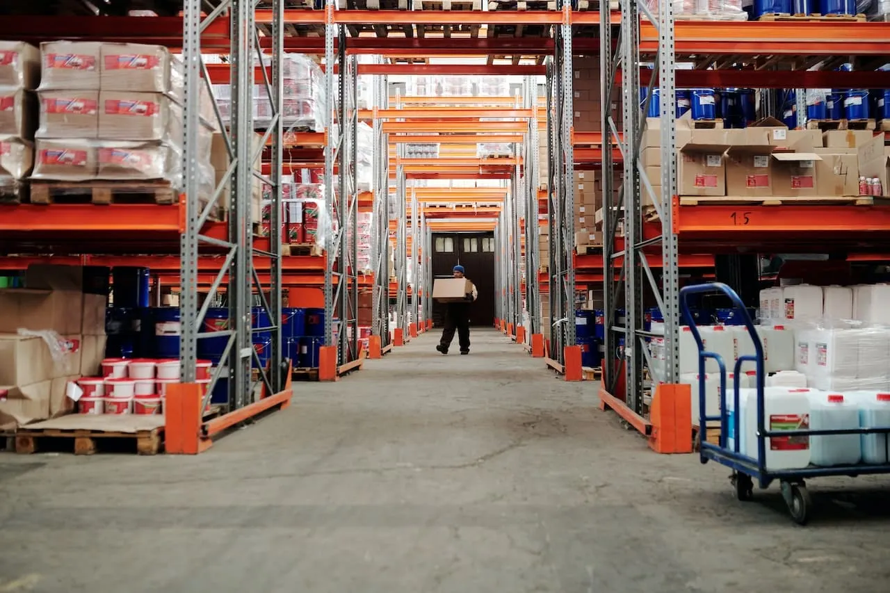 Pallet racking running the length of a distribution centre aisle
